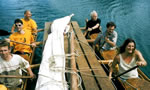 all paddling the double canoe